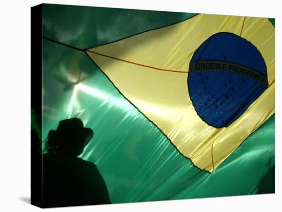 A Vendor Walks Behind a Big Brazilian Flag-null-Premier Image Canvas