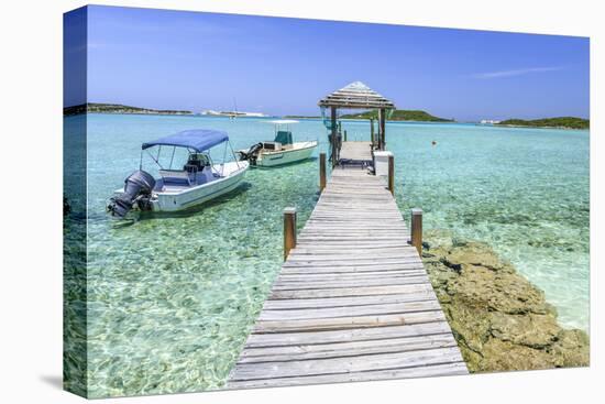 A Wood Pier Leads to Moored Boats and Clear Tropical Waters Near Staniel Cay, Exuma, Bahamas-James White-Premier Image Canvas