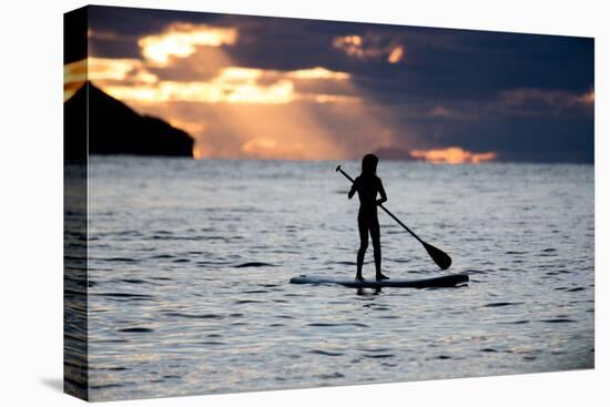 A Young Girl on a Stand Up Paddle Board on Baleia Beach at Sunset-Alex Saberi-Premier Image Canvas