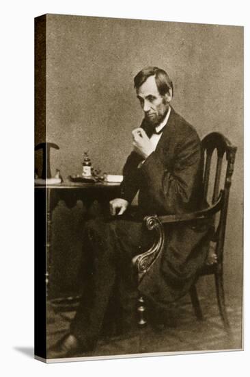 Abraham Lincoln Sitting at Desk, 1861-Mathew Brady-Premier Image Canvas