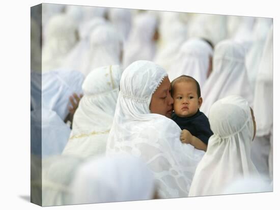 Acehnese Woman Holds a Child after Eid Al-Adha Prayer in the Tsunami-Ravaged Town of Meulaboh-null-Premier Image Canvas