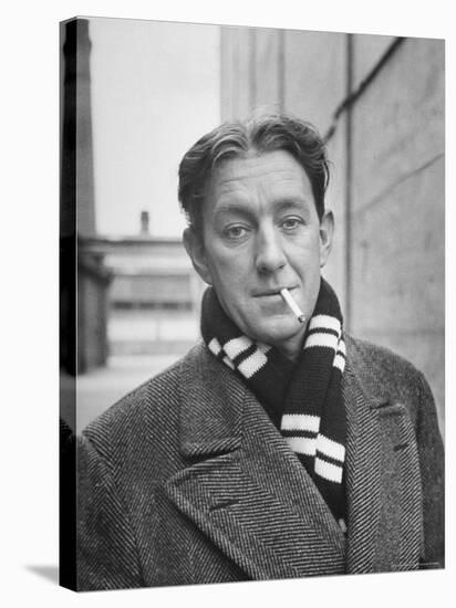 Actor Alec Guinness Dangling Cigarette from His Lips, on Movie Lot-Alfred Eisenstaedt-Premier Image Canvas