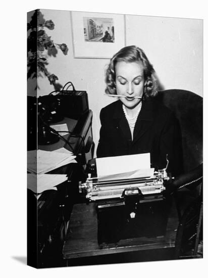 Actress Carole Lombard Typing While Holding Pencil Firmly in Her Mouth-Rex Hardy Jr.-Premier Image Canvas