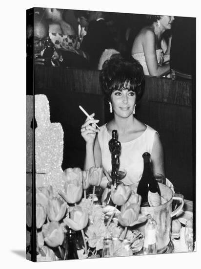 Actress Elizabeth Taylor at Hollywood Party After Winning Oscar, Which is on Table in Front of Her-Allan Grant-Premier Image Canvas