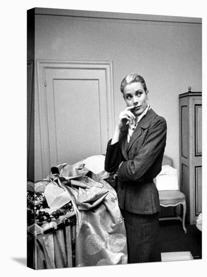 Actress Grace Kelly Packing Clothing Prior to Her Wedding to Prince Rainier-Lisa Larsen-Premier Image Canvas