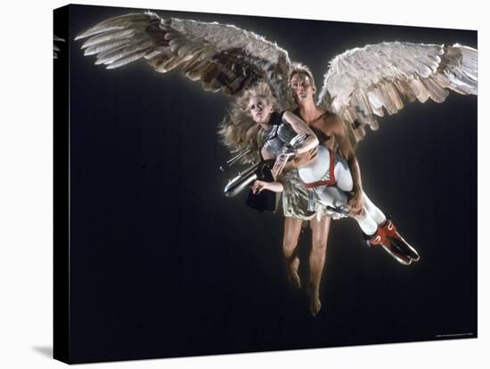 Actress Jane Fonda Being Carried by Guardian Angel in a Scene from Roger Vadim's Film "Barbarella"-Carlo Bavagnoli-Premier Image Canvas