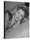 Actress Joan Fontaine Wearing Sheer Negligee While Lounging on Bed at Home-Bob Landry-Premier Image Canvas