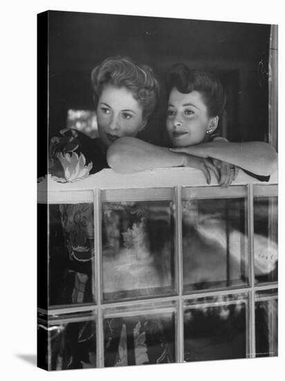 Actress Joan Fontaine with Actress Sister Olivia de Havilland Looking Out of Open Window at Home-Bob Landry-Premier Image Canvas