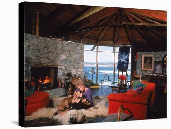 Actress Kim Novak Playing Guitar Beside Pet Great Dane Warlock at Her Home in Big Sur-Eliot Elisofon-Premier Image Canvas