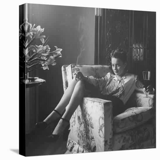 Actress Olivia de Havilland with Cigarette and Glass of Beer in While Relaxing at Home-Bob Landry-Premier Image Canvas