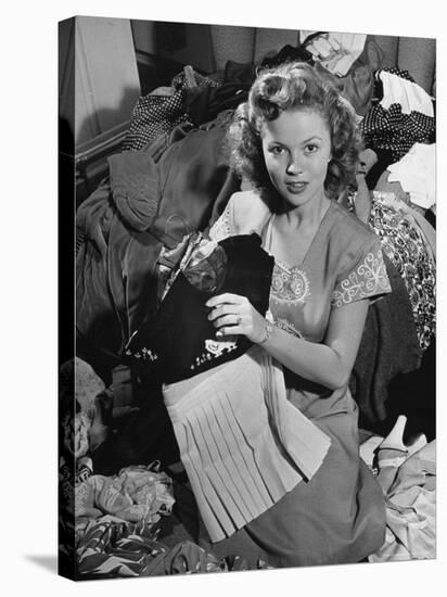 Actress Shirley Temple, Gathering Her Unwanted Clothes Together to Donate to a Clothing Drive-Martha Holmes-Premier Image Canvas