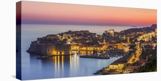 Aerial panorama of Dubrovnik Old Town at night with orange sunset sky, UNESCO World Heritage Site, -Neale Clark-Premier Image Canvas