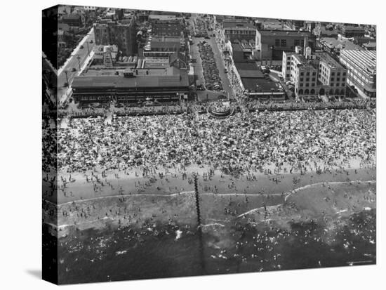 Aerial View of Crowds Enjoying a Hot 4th of July at Rockaway Beach-Sam Shere-Premier Image Canvas