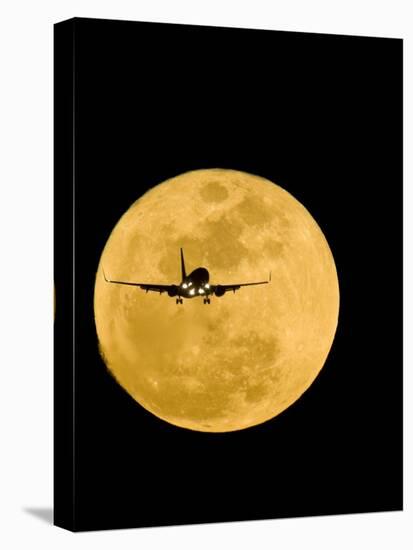 Aeroplane Silhouetted Against a Full Moon-David Nunuk-Premier Image Canvas