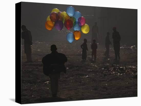 Afghan Boy Runs with Balloons to Join His Friends in Dusty Alley in Kabul, Afghanistan-null-Premier Image Canvas