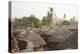 Africa, West Africa, Benin, Beri. Thatched rooves of traditional dwellings in front of palm trees.-Alida Latham-Premier Image Canvas