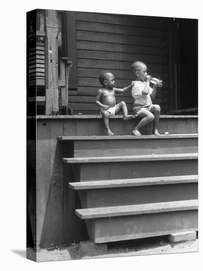 African American Boys at top of Stairs as Older Boy is Drinking Soda and Younger One Reaches for It-Alfred Eisenstaedt-Premier Image Canvas