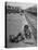 Aged Refugee Fighting Hunger, Sweeps Up Spilled Rice on the Railroad Station Platform-Jack Birns-Premier Image Canvas