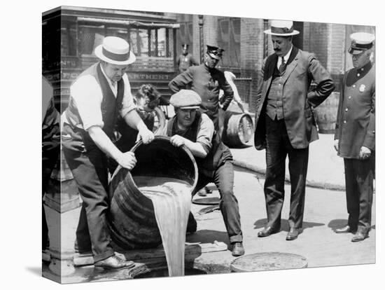 Agents pour liquor into sewer following a raid during the height of prohibition, New York, 1921-null-Premier Image Canvas