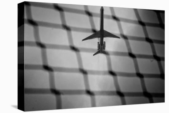Airplane Through Fence B/W-null-Stretched Canvas