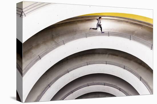 Airport Car Park, Stuttgart, Baden-Württemberg, Germany: A Male Runner Running Through A Car Park-Axel Brunst-Premier Image Canvas