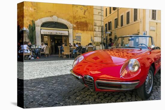 Alfa Romeo Duetto spider parked in a cobblestone street of Rome, Lazio, Italy-Stefano Politi Markovina-Premier Image Canvas