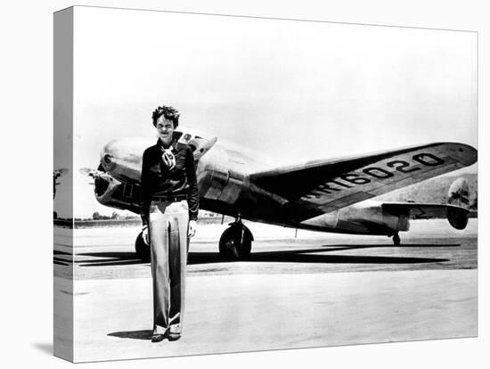 Amelia Earhart Standing in Front of the Lockheed Electra in Which She Disappeared in July 29, 1937-null-Stretched Canvas