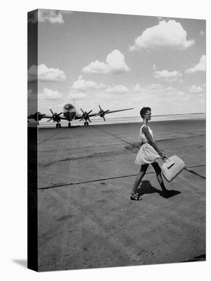 American Airline Hostess Crossing Field on Way to Jobs as a Model and Sales Clerk at Neiman Marcus-Lisa Larsen-Premier Image Canvas