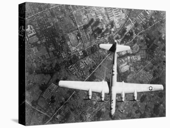 American B-29 Super Fortress Bomber over Nakajima Aircraft Co.-null-Stretched Canvas