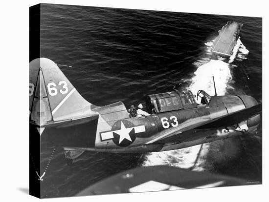 American SB2C Scout Plane Circling Above an Aircraft Carrier Prior to Landing-null-Premier Image Canvas