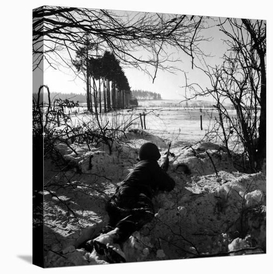 American Soldier Peering Across Snowy Field During Counter Offensive Known as Battle of the Bulge-John Florea-Premier Image Canvas