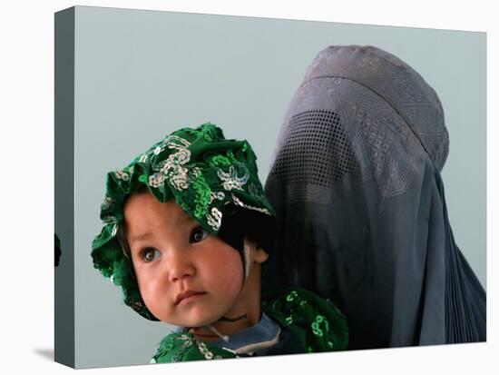 An Afghan Mother Waits with Her Daughter Before Attending Medical Care-null-Premier Image Canvas