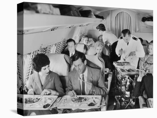 An Airline Steward and Air Hostess Serve a Roast Meal to Flight Passengers-null-Premier Image Canvas
