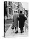 An Elderly Couple Walking Down the Street, Arm in Arm-Henry Grant-Premier Image Canvas