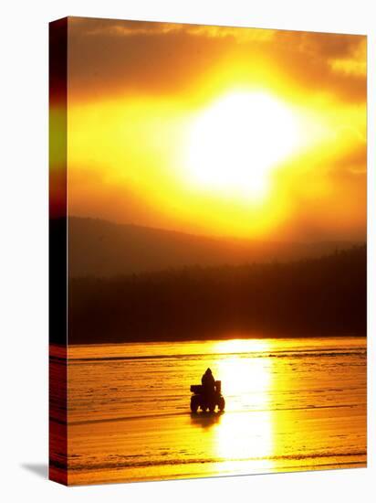 An Ice Fisherman Motors Across the Frozen Surface of Lake Champlain Near the Milton-South Hero, VT.-null-Premier Image Canvas