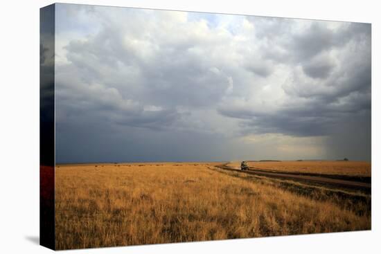 An off-road vehicle driving in the African savanna, Masai Mara Game Reserve, Kenya, East Africa, Af-null-Premier Image Canvas