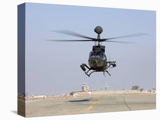 An Oh-58D Kiowa Warrior Hovers over the Flight Line at Camp Speicher, Iraq-null-Premier Image Canvas