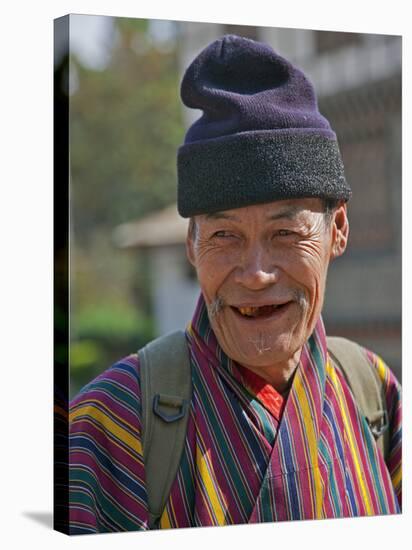 An Old Man at Trashigang Wearing the Traditional Gho Robe of All Bhutanese Men-Nigel Pavitt-Premier Image Canvas