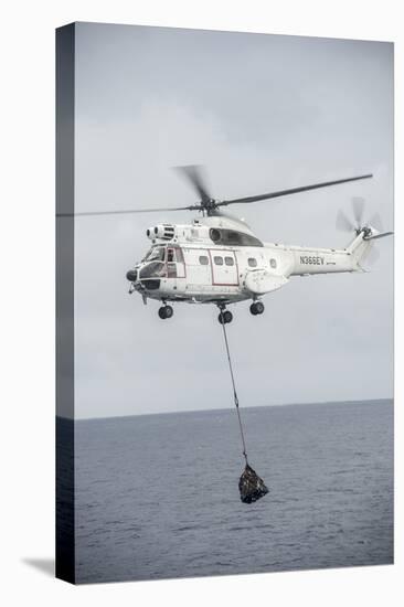 An SA-330 Puma Transport Helicopter Moves Cargo During a Vertical Replenishment-null-Premier Image Canvas