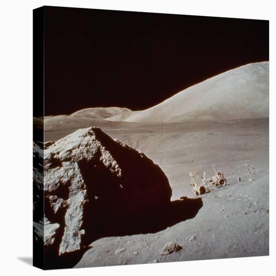 Apollo 17's Rover, a Lunar Vehicle, on the Surface of the Moon Next to Giant Rock-null-Premier Image Canvas