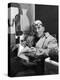 Architect Le Corbusier Sitting in Chair and Holding Book in Hands-Nina Leen-Premier Image Canvas