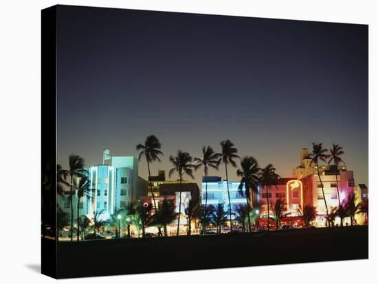 Art Deco Hotels at Dusk, Miami Beach, Florida, USA-Walter Bibikow-Premier Image Canvas