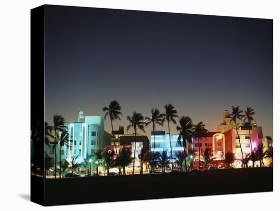 Art Deco Hotels at Dusk, Miami Beach, Florida, USA-Walter Bibikow-Premier Image Canvas