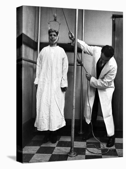 Arthritis Patient Being Treated with Stretching Device at Clinic-Alfred Eisenstaedt-Premier Image Canvas