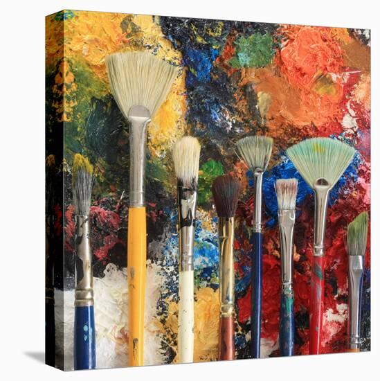 Artist Brushes On An Oil Painting Background-Hannamariah-Stretched Canvas