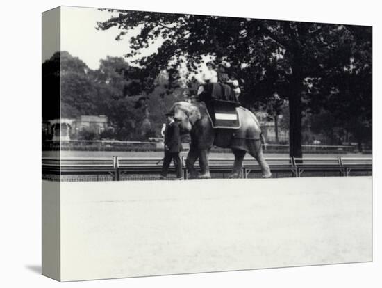 Asian Elephant 'Jessie' Giving a Ride to Two Ladies and a Child-Frederick William Bond-Premier Image Canvas