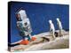 Astronaut Figurines Standing Beside Gray Toy Rocket-null-Premier Image Canvas