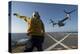 Aviation Boatswain's Mate Directs an MV-22 Osprey as it Launches from the Flight Deck-null-Premier Image Canvas