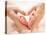 Baby Feet in Mother Hands. Tiny Newborn Baby's Feet on Female Heart Shaped Hands Closeup. Mom and H-Subbotina Anna-Premier Image Canvas