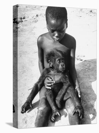 Baby Gorilla Named Bobo is Being Held by a Local Youngster-Eliot Elisofon-Premier Image Canvas